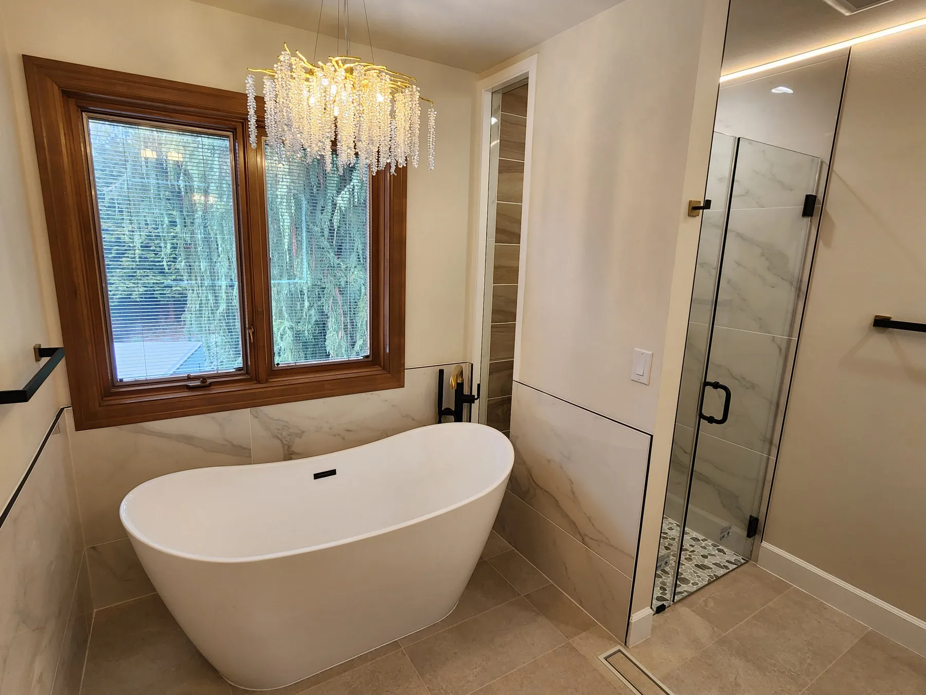 After — bare studs to a freestanding tub under the original window — Edmonds