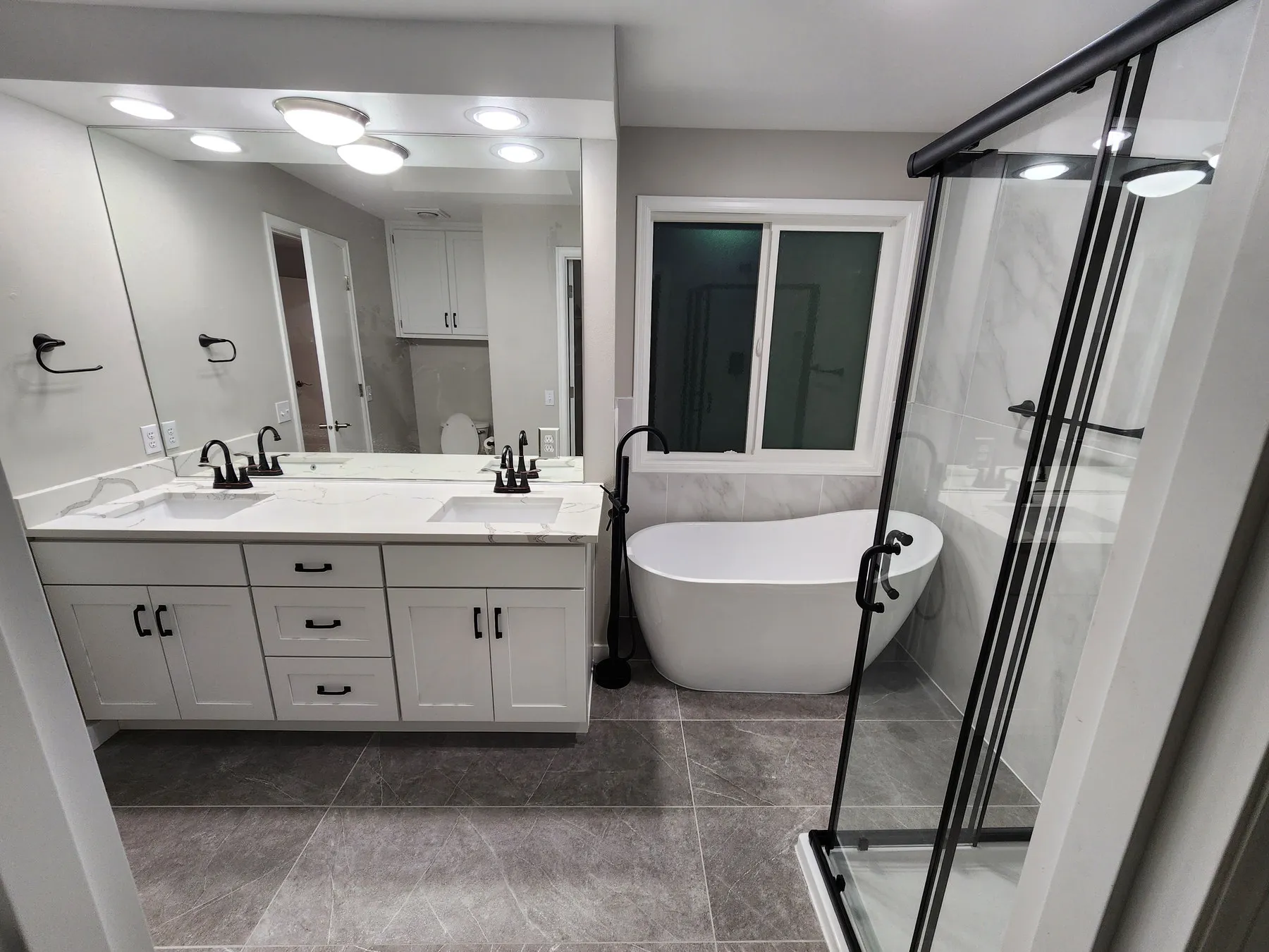 After — laminate double vanity and corner tub to shaker and freestanding — Overlake, Redmond